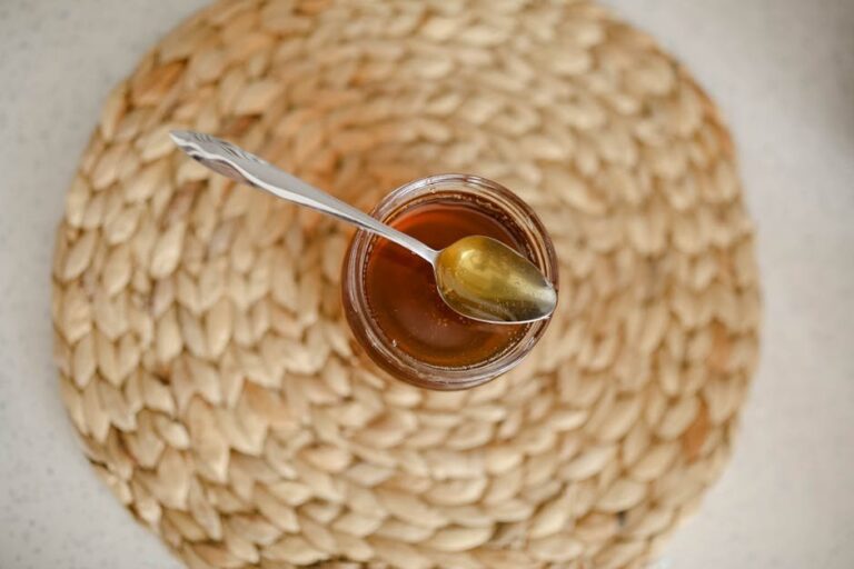 honeycomb in jar of honey